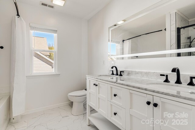 bathroom featuring toilet, marble finish floor, a sink, and visible vents