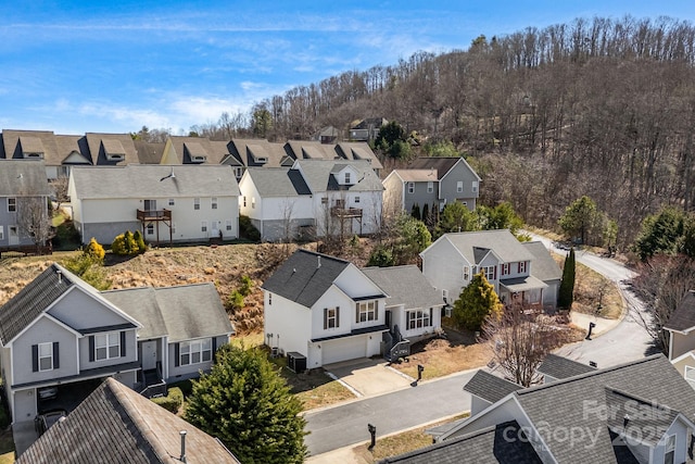 birds eye view of property with a residential view