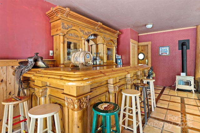 bar featuring a wood stove