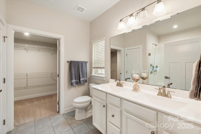 full bathroom featuring a stall shower, visible vents, a sink, and double vanity