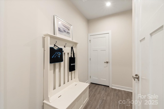 mudroom featuring wood finished floors and baseboards