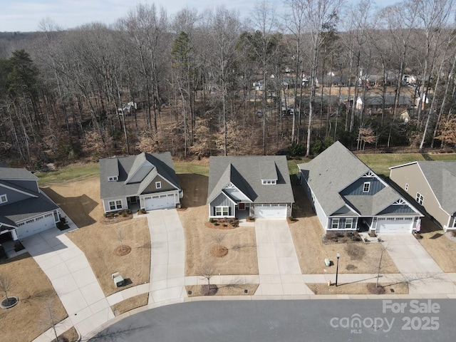 aerial view featuring a view of trees