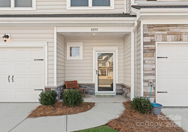 entrance to property featuring a garage