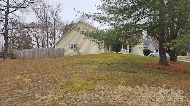 view of side of property with a yard