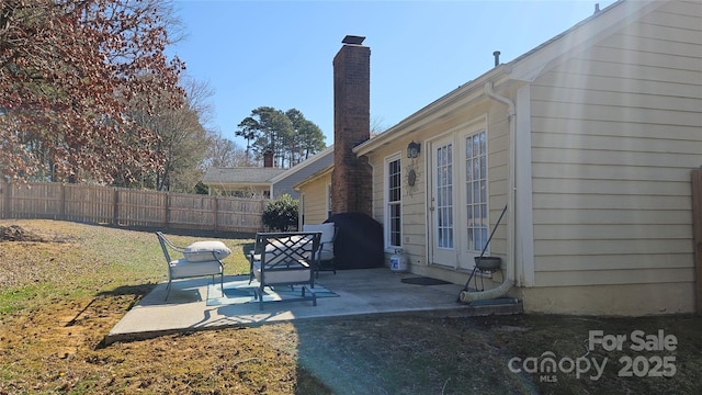 view of patio featuring fence