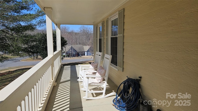 balcony featuring a porch