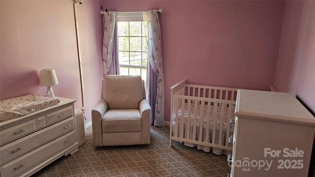 bedroom with a nursery area