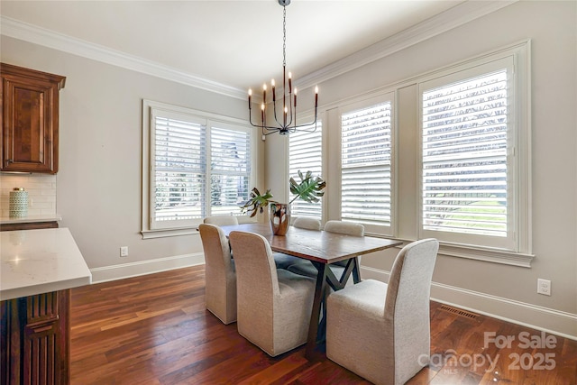 dining area with a chandelier, crown molding, and dark hardwood / wood-style floors