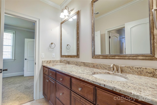 bathroom featuring vanity, crown molding, and tile patterned floors