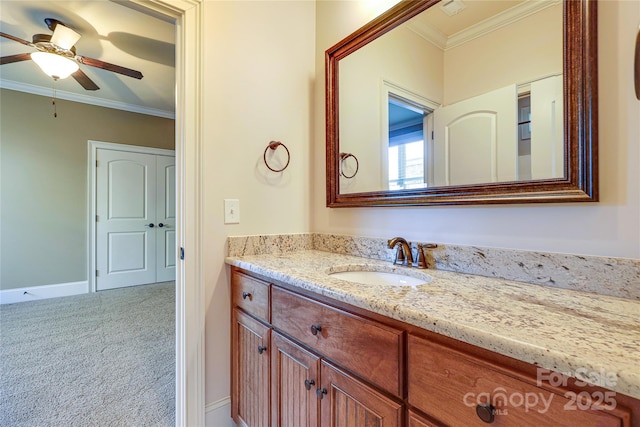 bathroom featuring ceiling fan, vanity, and ornamental molding