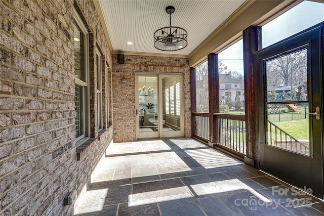 unfurnished sunroom with plenty of natural light