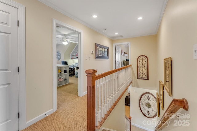 hall with recessed lighting, light carpet, an upstairs landing, baseboards, and crown molding