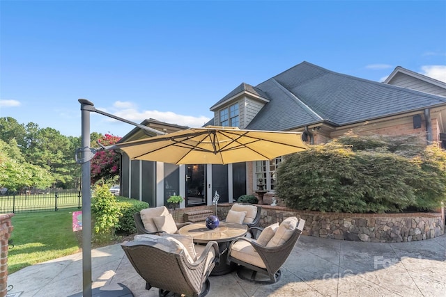 view of patio / terrace featuring fence