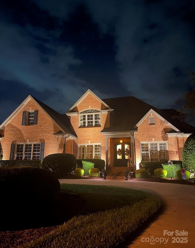 view of front of house featuring brick siding