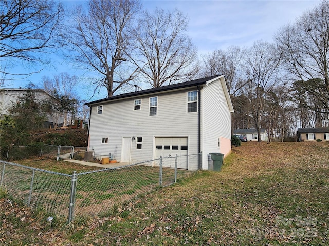 back of house featuring central air condition unit, fence, and a lawn