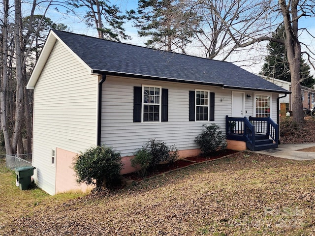 view of front of home with roof with shingles