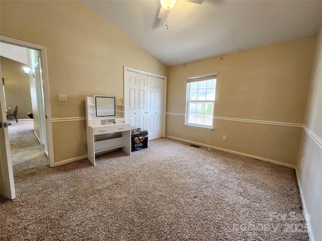 bedroom with ceiling fan, carpet floors, baseboards, vaulted ceiling, and a closet