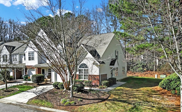 view of front facade with a front lawn and a garage