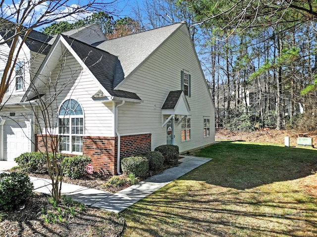 view of front of property with a front yard and a garage