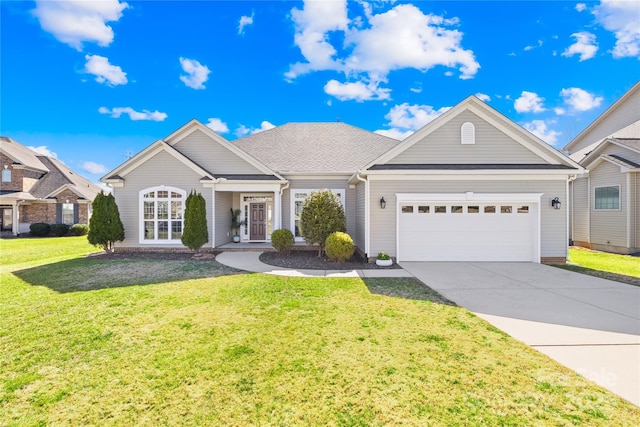 ranch-style home featuring a front yard, driveway, and an attached garage