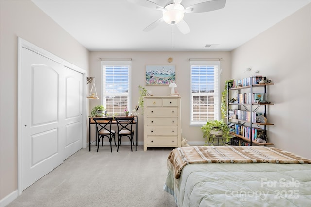 bedroom featuring carpet, multiple windows, visible vents, and baseboards