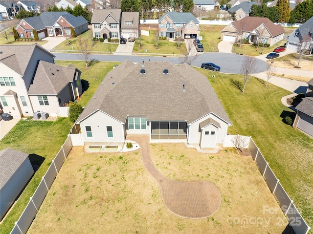 birds eye view of property with a residential view