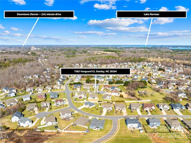 birds eye view of property with a residential view