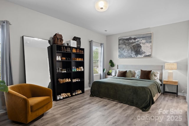 bedroom with hardwood / wood-style floors