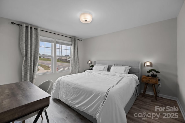 bedroom featuring dark wood-type flooring