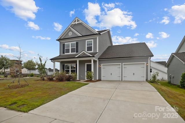 craftsman-style house with covered porch, a garage, and a front yard