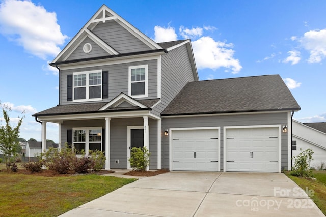 craftsman house featuring a garage, a porch, and a front lawn