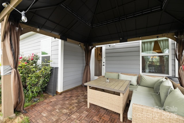 view of patio / terrace featuring an outdoor hangout area and a gazebo