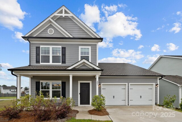 201 Bennett Trail Dr, Mount Holly, NC 28120 - view of front of property featuring an attached garage, driveway, roof with shingles, and a porch