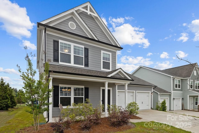 201 Bennett Trail Dr, Mount Holly, NC 28120 - view of front of property with concrete driveway, an attached garage, a porch, and roof with shingles