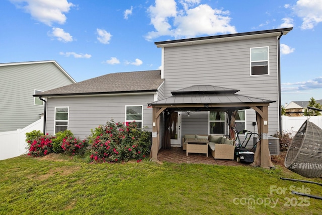 201 Bennett Trail Dr, Mount Holly, NC 28120 - back of property with an outdoor hangout area, a gazebo, central AC unit, and a patio
