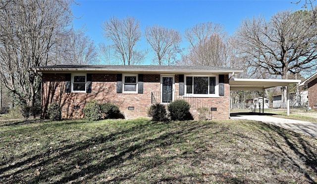 ranch-style home with a front yard and a carport