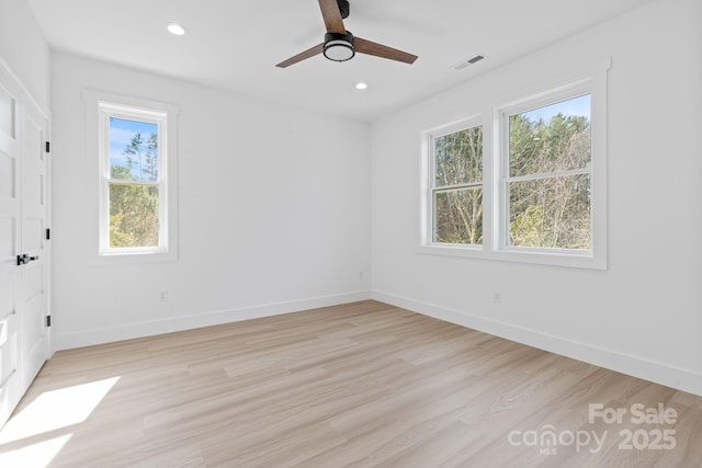 unfurnished bedroom with light wood finished floors, visible vents, baseboards, and recessed lighting