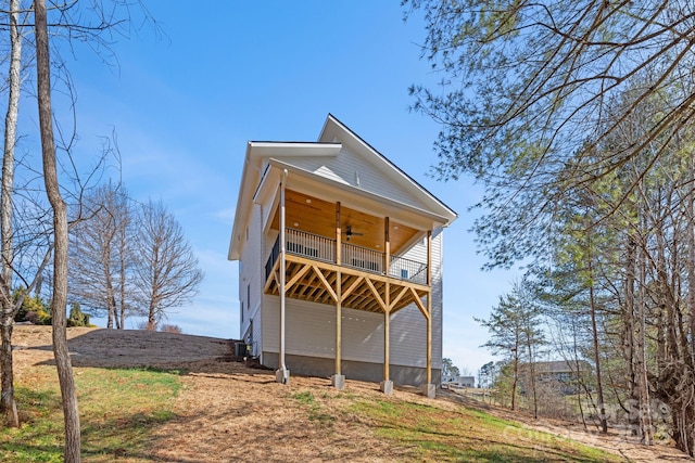 exterior space featuring ceiling fan and a wooden deck