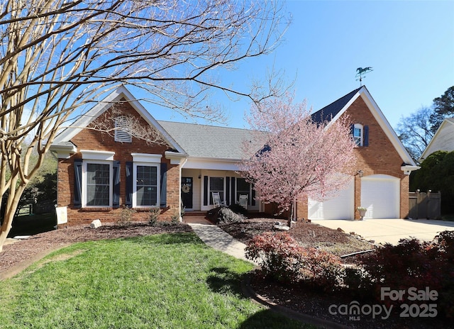 view of front facade featuring a garage, driveway, brick siding, and a front yard