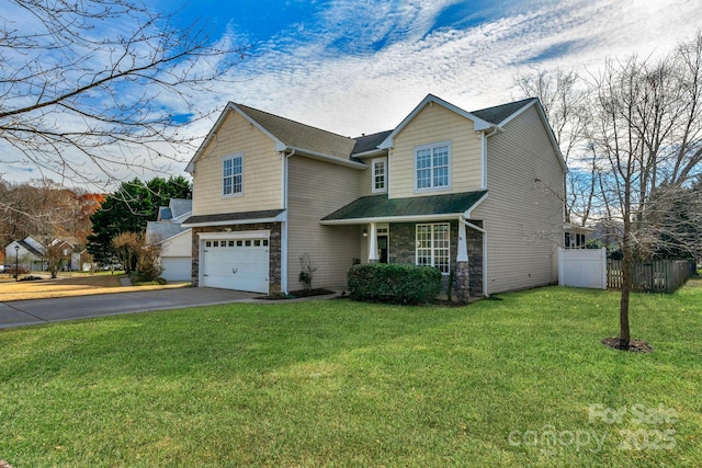 view of front property featuring a garage and a front lawn