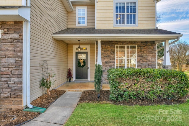 property entrance with covered porch