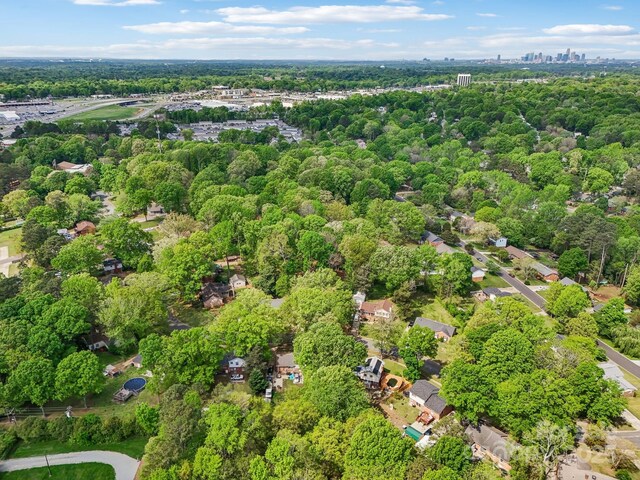 bird's eye view featuring a forest view