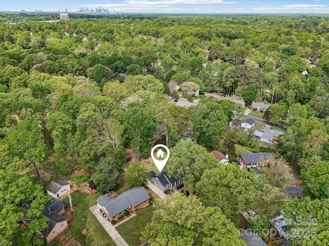 drone / aerial view with a view of trees