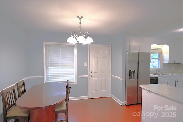 6126 Eagle Peak Dr, Charlotte, NC 28214 - dining room featuring baseboards and a chandelier