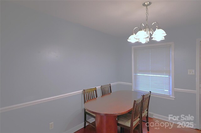 6126 Eagle Peak Dr, Charlotte, NC 28214 - dining space with a chandelier and baseboards