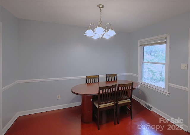 6126 Eagle Peak Dr, Charlotte, NC 28214 - dining space featuring wood finished floors, visible vents, baseboards, and a notable chandelier