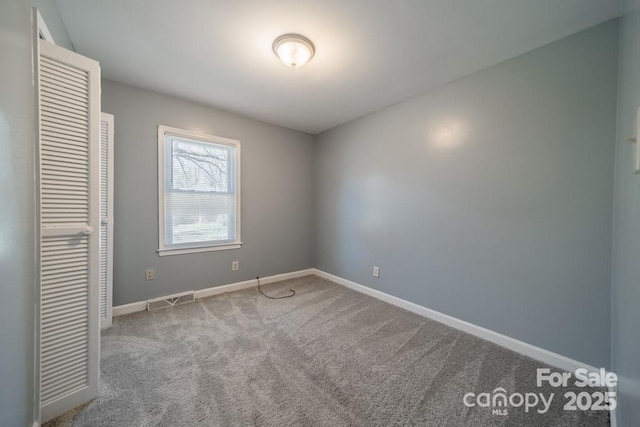 6126 Eagle Peak Dr, Charlotte, NC 28214 - unfurnished bedroom with a closet, carpet, visible vents, and baseboards