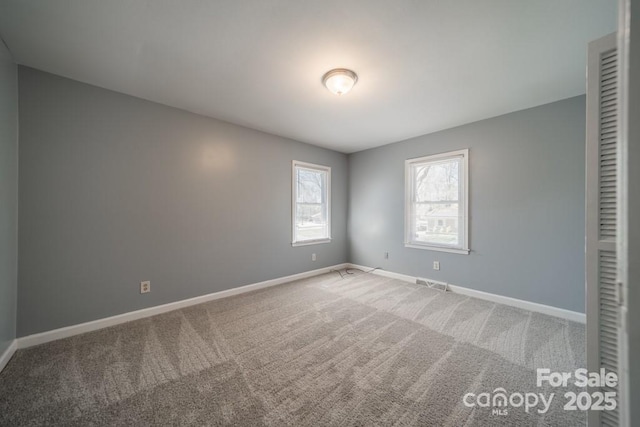 6126 Eagle Peak Dr, Charlotte, NC 28214 - spare room featuring carpet floors, visible vents, and baseboards