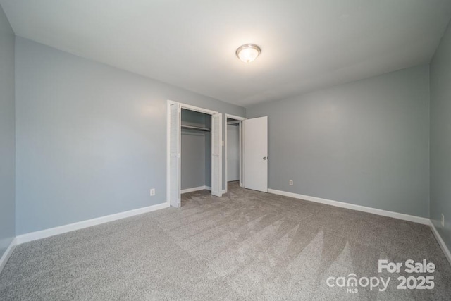 6126 Eagle Peak Dr, Charlotte, NC 28214 - unfurnished bedroom featuring carpet floors, a closet, and baseboards