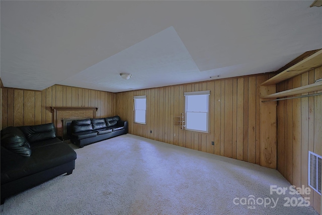6126 Eagle Peak Dr, Charlotte, NC 28214 - carpeted living room featuring visible vents and wooden walls